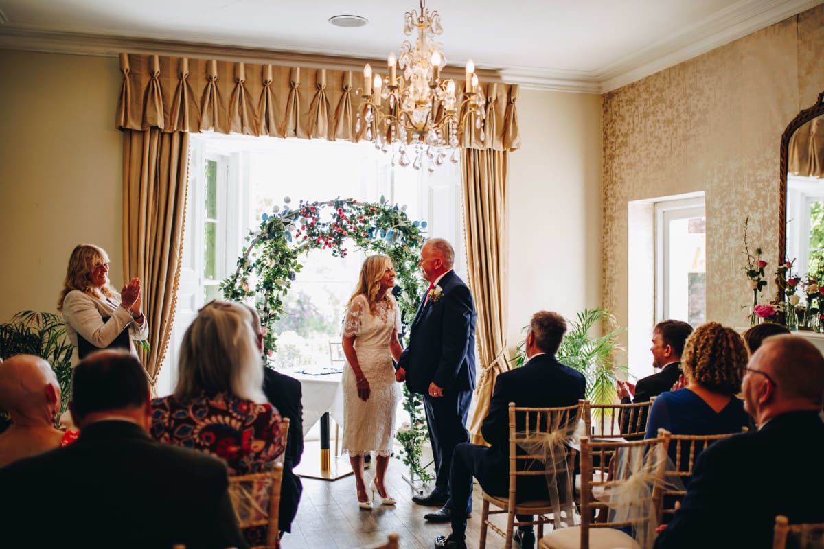 Mature couple getting married with an indoor ceremony